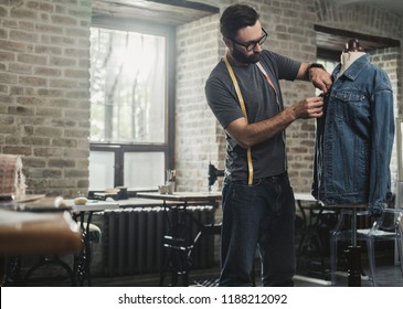 Fashion Designer Working In His Studio