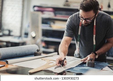 Fashion Designer Working In His Studio