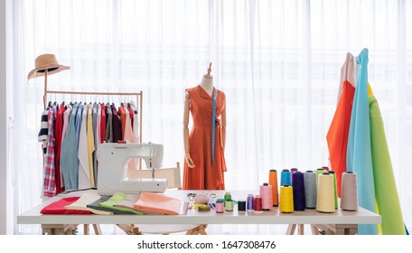 Fashion designer working studio, with sewing items and materials on working table