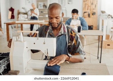 Fashion designer, young man and creative student in a workshop to sew clothes and garments. Factory worker, tailor and apprentice learning sewing machine skills in a textile and manufacturing studio - Powered by Shutterstock