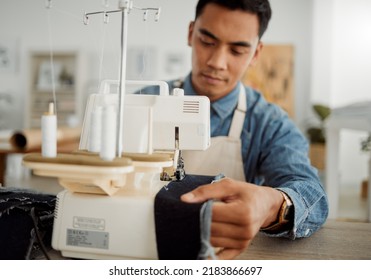 Fashion designer, young man and tailor in a creative workshop to sew clothes and garments. Factory worker, student and apprentice learning sewing machine skills in a textile and manufacturing studio - Powered by Shutterstock