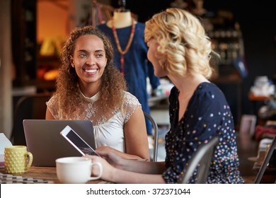 Fashion Designers In Meeting Using Laptop And Digital Tablet - Powered by Shutterstock