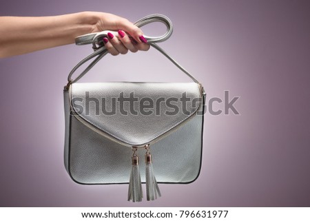 Fashion. Female hand Stylish Trendy Handbag clutch