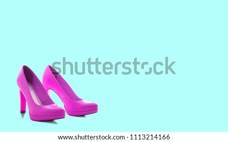 Fashion female pink shoes with heels. Women's footwear casual design isolated on blue background with copyspace for text.