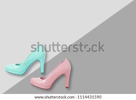 Fashion female pink shoes with heels. Women's footwear casual design isolated on grey background with copyspace for text.
