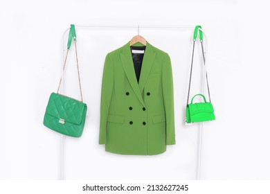 Fashion Formal Green Suit, Jacket Closeup On Hanger With Two Handbag