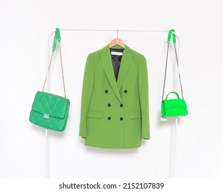 Fashion Formal Green Suit, Jacket Closeup On Hanger With Two Handbag