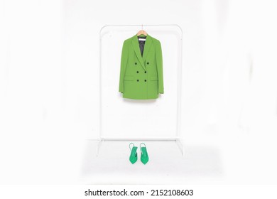 Fashion Formal Green Suit, Jacket Closeup On Hanger With Green High Hell Shoes 