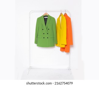 Fashion Formal Yellow ,green Suit, Jacket And Orange Coat On Hanger