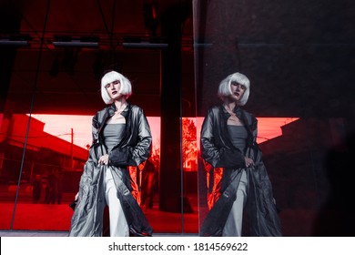 Fashion Of The Future. Futuristic Blonde In Red Space. High Quality Photo