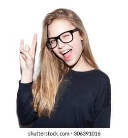 Fashion girl hipster giving the Rock and Roll sign . Pretty models smiling on white background, not isolated. Toned