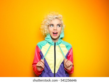 Fashion Girl In Sportswear On Yellow Background