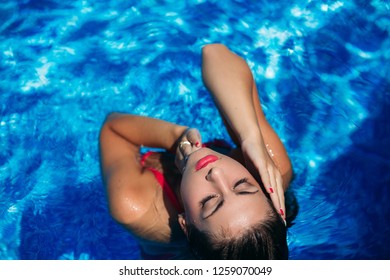 Fashion Girl With Waterproof Makeup In Swimming Pool. Sexy Girl