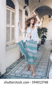 Fashion Girl Wearing Bohemian Clothing Posing In The Old City Street. Boho Chic Fashion Style.