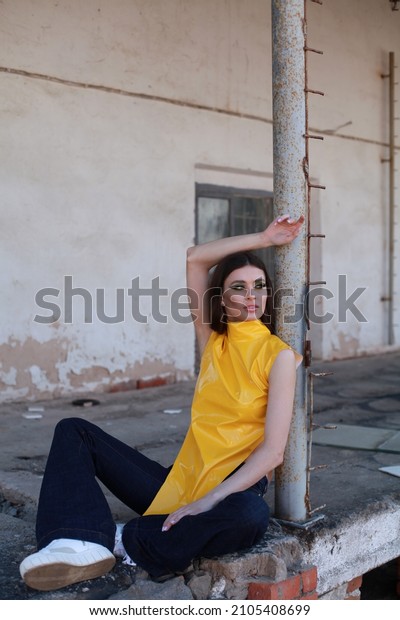 yellow sleeveless turtleneck