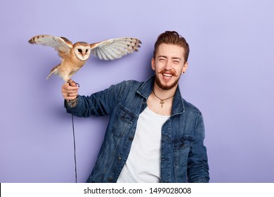 Fashion Guy Laughing At His Bird. Happiness, Friendship Concept. Close Up Portrait. Studio Shot. Positive Feeling And Emotion