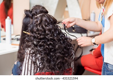 Fashion hairdresser doing hairstyle to young woman - Shutterstock ID 431521594