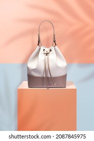 Fashion handbag isolated on a purple shiny background with clipping mask