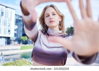 Fashion, Hands And Frame With The Face Of A Woman With Beauty Outside In The City. Portrait, Style And Model With An Attractive Or Edgy Female Standing Outside On An Urban Background In Summer