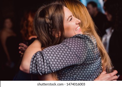 Fashion Happy Brown Hair Surprised Excited Woman Or Girl With Pigtail Laughing Smiling Hugging With Friend On Celebration Birthday Party In City Cafe Night Club Premium Restaurant With Girls Friends