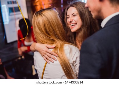 Fashion Happy Brown Hair Surprised Excited Woman Or Girl With Pigtail Laughing Smiling Hugging With Friend On Celebration Birthday Party In City Cafe Night Club Premium Restaurant With Girls Friends