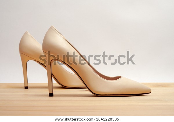 Fashion high heels women shoes\
beige color. Stiletto shoe style in ladies wardrobe. High\
fashion.