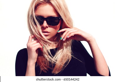 Fashion hipster girl in cool sunglasses.