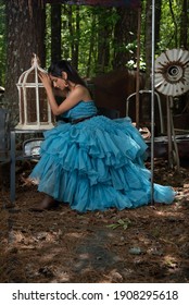 Fashion Image Of Beautiful Asian Indian Woman Wearing Blue Gown In A Junk Yard. 