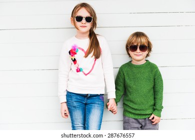 Fashion Kids Outdoors, Wearing Pullovers And Sunglasses