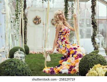 Fashion Lady In Spring Scenery Wearing Flower Dress