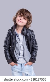 Fashion little boy wearing a leather jacket