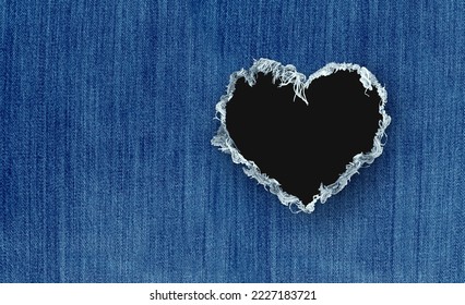 Fashion love and clothing apparel retail industry as clothes trends and garments wearing denim orblue jeans pants as textile with a hole shaped as a heart as a symbol for Valentine or romance - Powered by Shutterstock