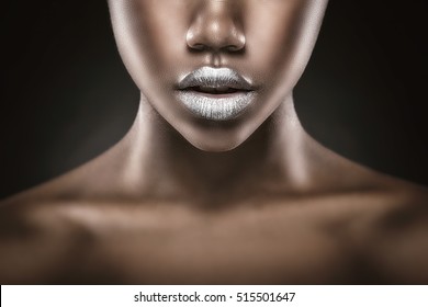 Fashion makeup. Close-up of silver lips African American young woman