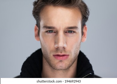 Fashion Man Face Close Up, Handsome Serious Beauty Male Model Closeup Portrait, Young Guy Over Gray Background