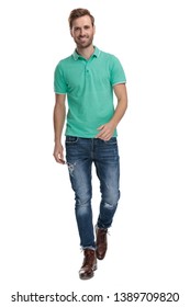 Fashion Man In Green Polo Shirt Walking On White Background