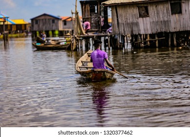 Fashion man in his canoe on Ganvie, venice of Africa