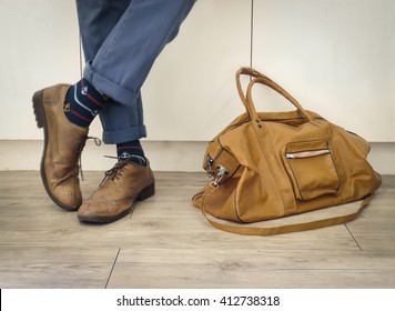 Fashion Man Legs In Indigo Navy Blue Pants, Navy Anchor Socks, Leather Shoes And Leather Tote Bag ( Vintage Tone Color )