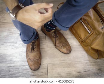 Fashion Man Legs In Indigo Navy Blue Pants, Navy Anchor Socks, Leather Shoes And Leather Tote Bag ( Vintage Tone Color )