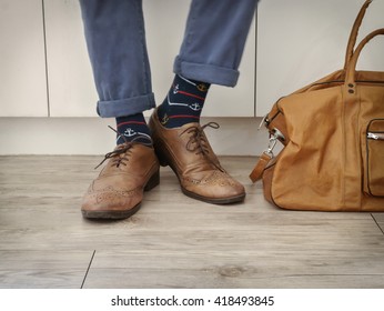 Fashion Man Legs In Indigo Navy Blue Pants, Navy Anchor Socks, Leather Shoes And Leather Tote Bag ( Vintage Tone Color )