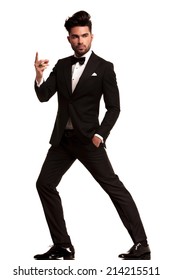 Fashion Man In Tuxedo Snapping His Finger , Full Body Picture On White Background