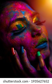 Fashion model Asian girl portrait with colorful powder make up. Beauty woman with bright color makeup. close-up Beauty fashion art portrait