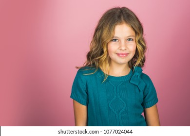 Fashion model and beauty look. Stylish girl with pretty face on grey background. Hairdresser, skincare, casual style, denim. Beauty and kid fashion with healthy hair. Little girl with long hair.