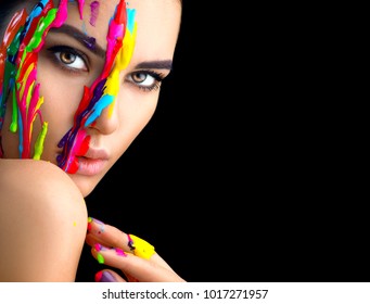 Fashion Model Girl colorful face paint. Beauty fashion art portrait of beautiful woman with flowing liquid paint, abstract makeup. Vivid paint make-up, bright colors. Vogue Multicolor creative make-up