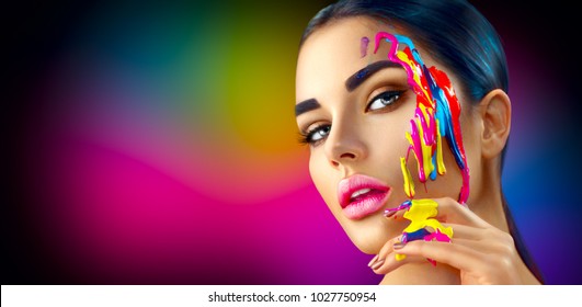 Fashion Model Girl Colorful Face Paint. Beauty Fashion Art Portrait Of Beautiful Woman With Flowing Liquid Paint, Abstract Makeup. Vivid Paint Make-up, Bright Colors. Vogue Multicolor Creative Make-up