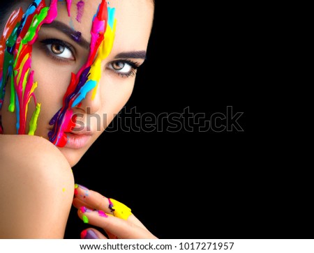 Fashion Model Girl colorful face paint. Beauty fashion art portrait of beautiful woman with flowing liquid paint, abstract makeup. Vivid paint make-up, bright colors. Vogue Multicolor creative make-up