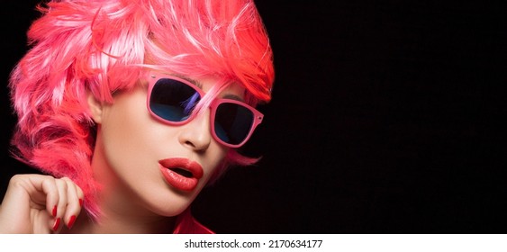 Fashion Model Girl With Stylish Pink Hair And Sunglasses. Dyed Hair And Fashion Wigs Concept. Isolated On Black Background With Copy Space