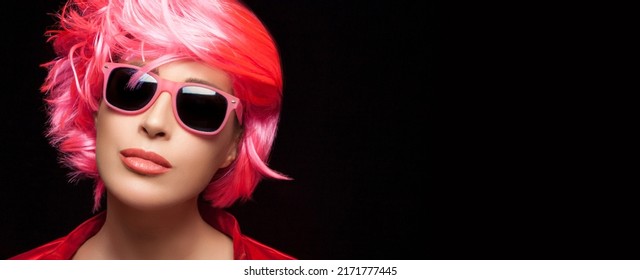 Fashion Model Girl With Stylish Pink Hair And Sunglasses. Dyed Hair And Fashion Concept. Isolated On Black Background With Copy Space