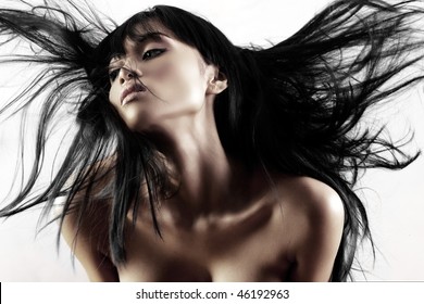 Fashion model with hair blowing in the wind