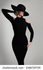 Fashion Model Long Dress, Wide Brimmed Hat, Elegant Lady Beauty Portrait, Woman Posing on White Studio background