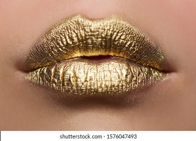 Fashion model make up. Beauty makeup artist ideas. Colorful lips golden art. Gold bright make-up in lips for party. Lips make up concept